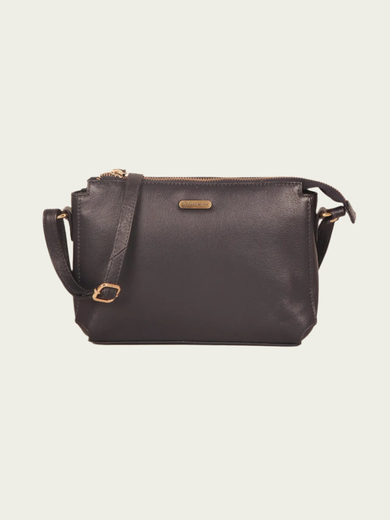 Blue slingbag with gold accents