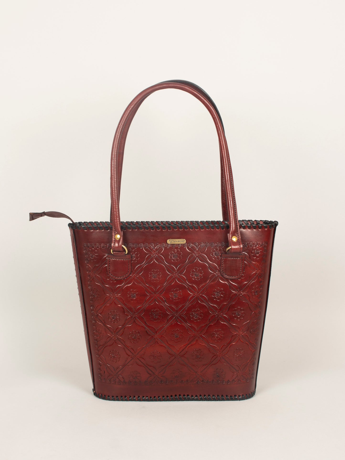 Front view of genuine leather handbag for women by Tan & Brown, classic tote design with premium finish.