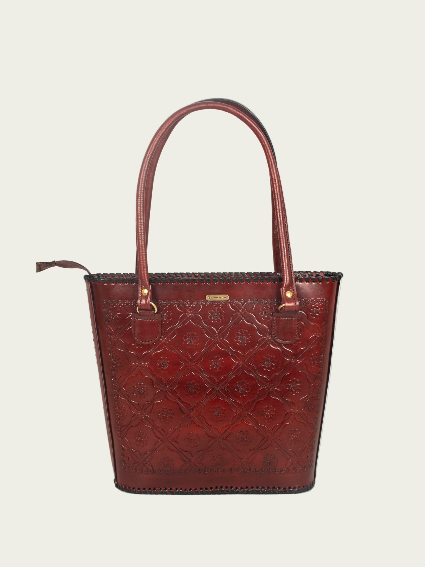 Front view of genuine leather handbag for women by Tan & Brown, classic tote design with premium finish.
