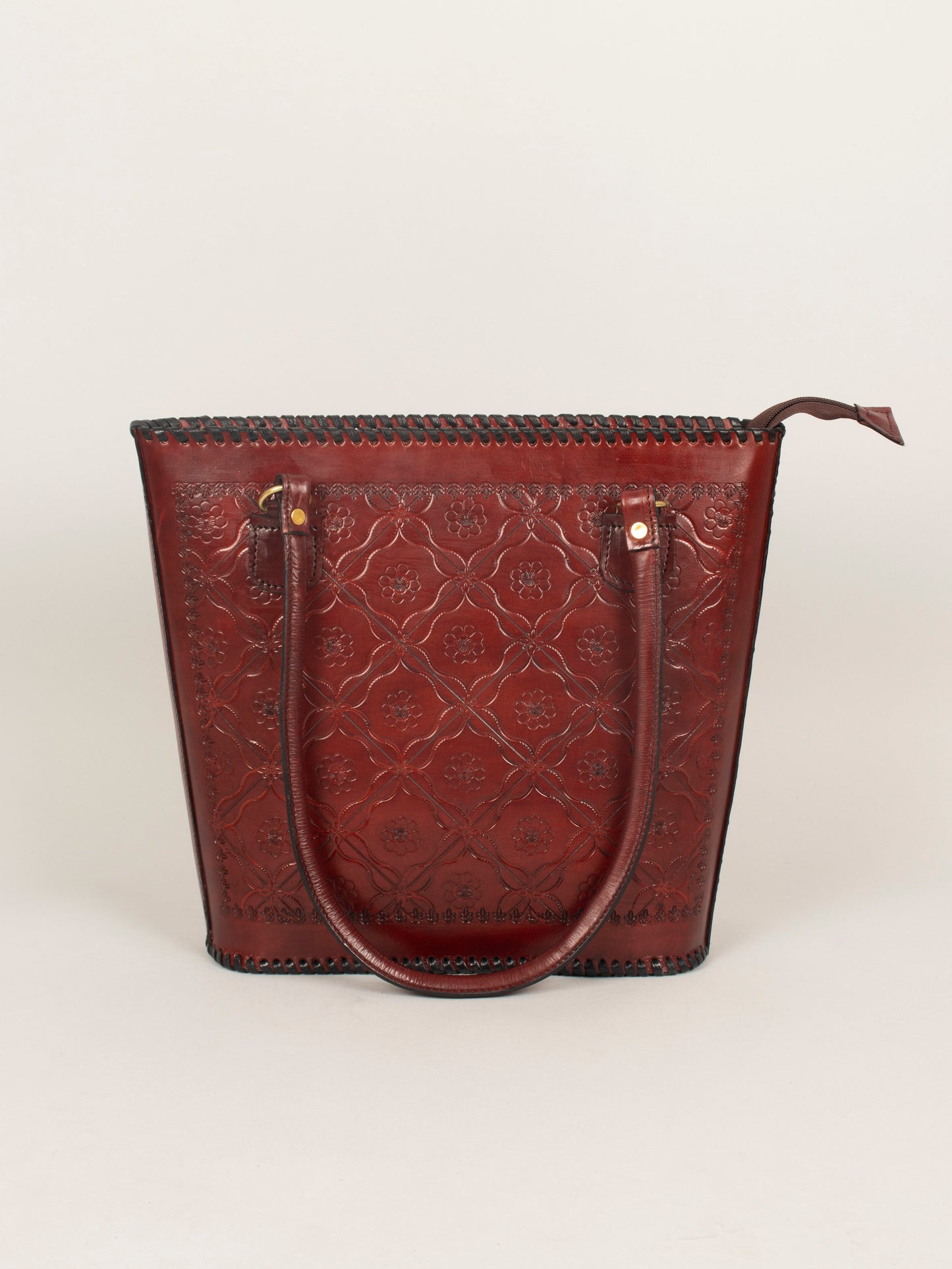 Inside view of pure leather shoulder bag showing zip compartments, accessory pocket, and mobile/card slot.