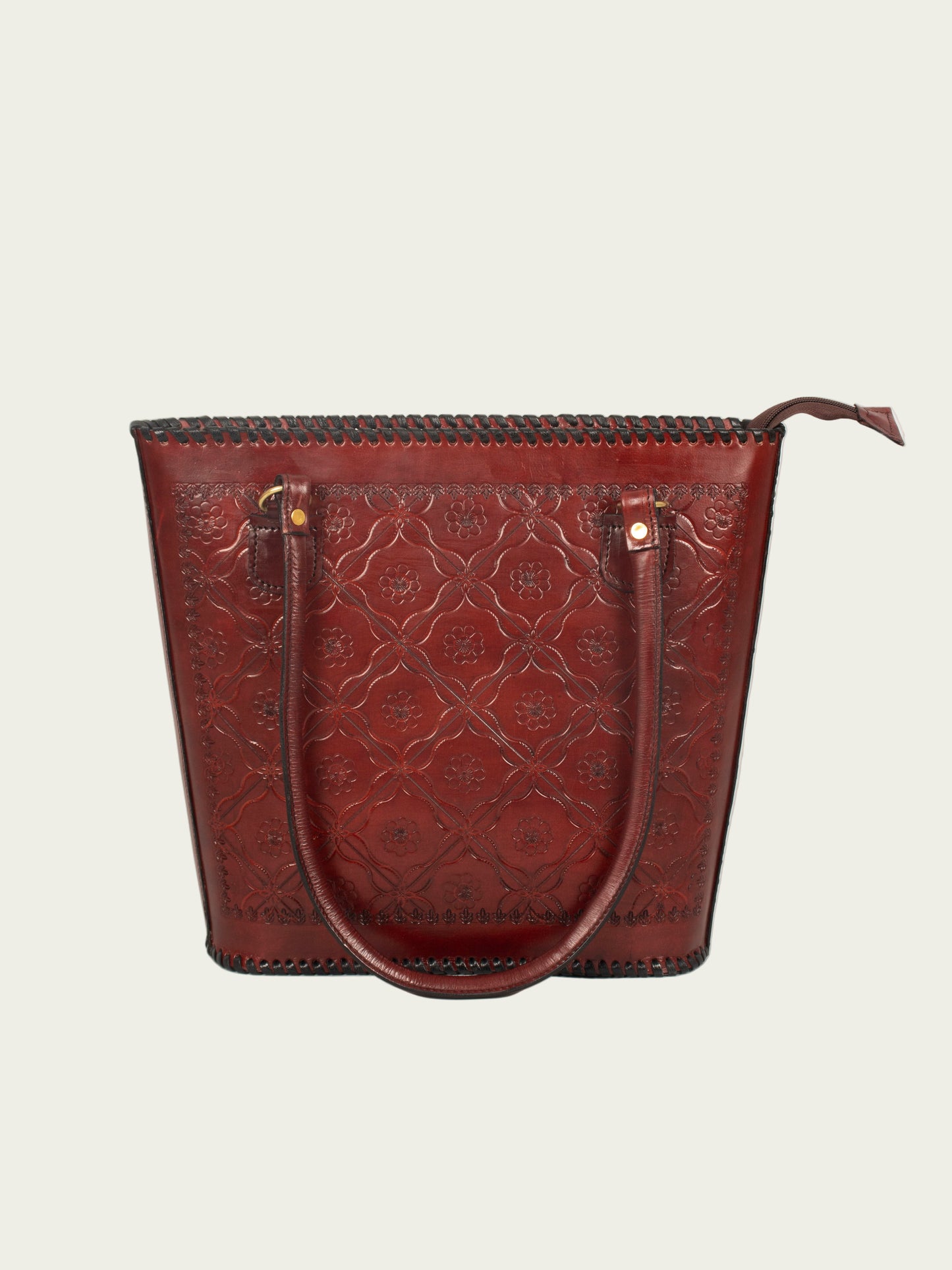 Inside view of pure leather shoulder bag showing zip compartments, accessory pocket, and mobile/card slot.