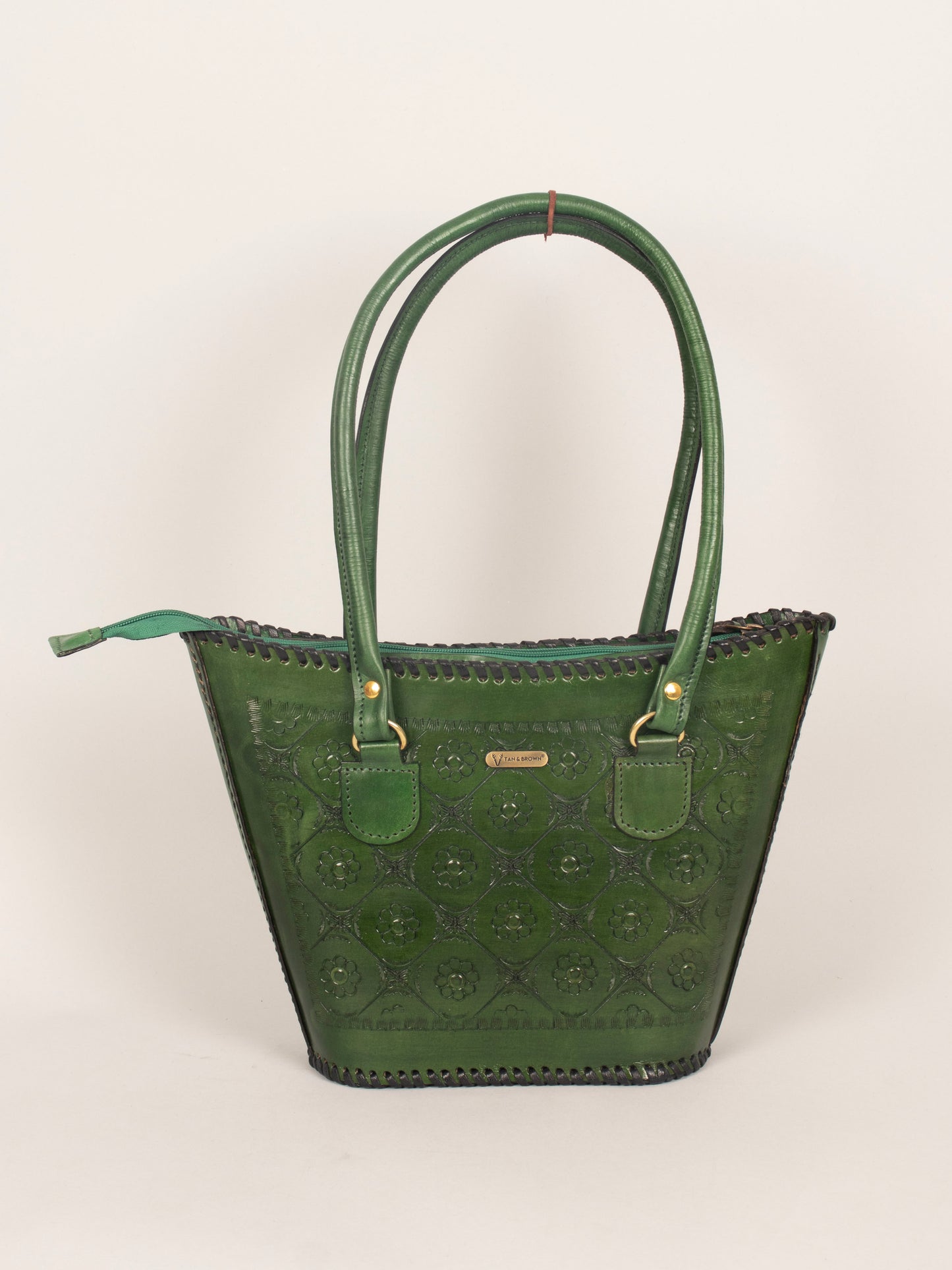 Woman carrying a Tan & Brown genuine leather shoulder bag – ideal for office, travel, and daily use.