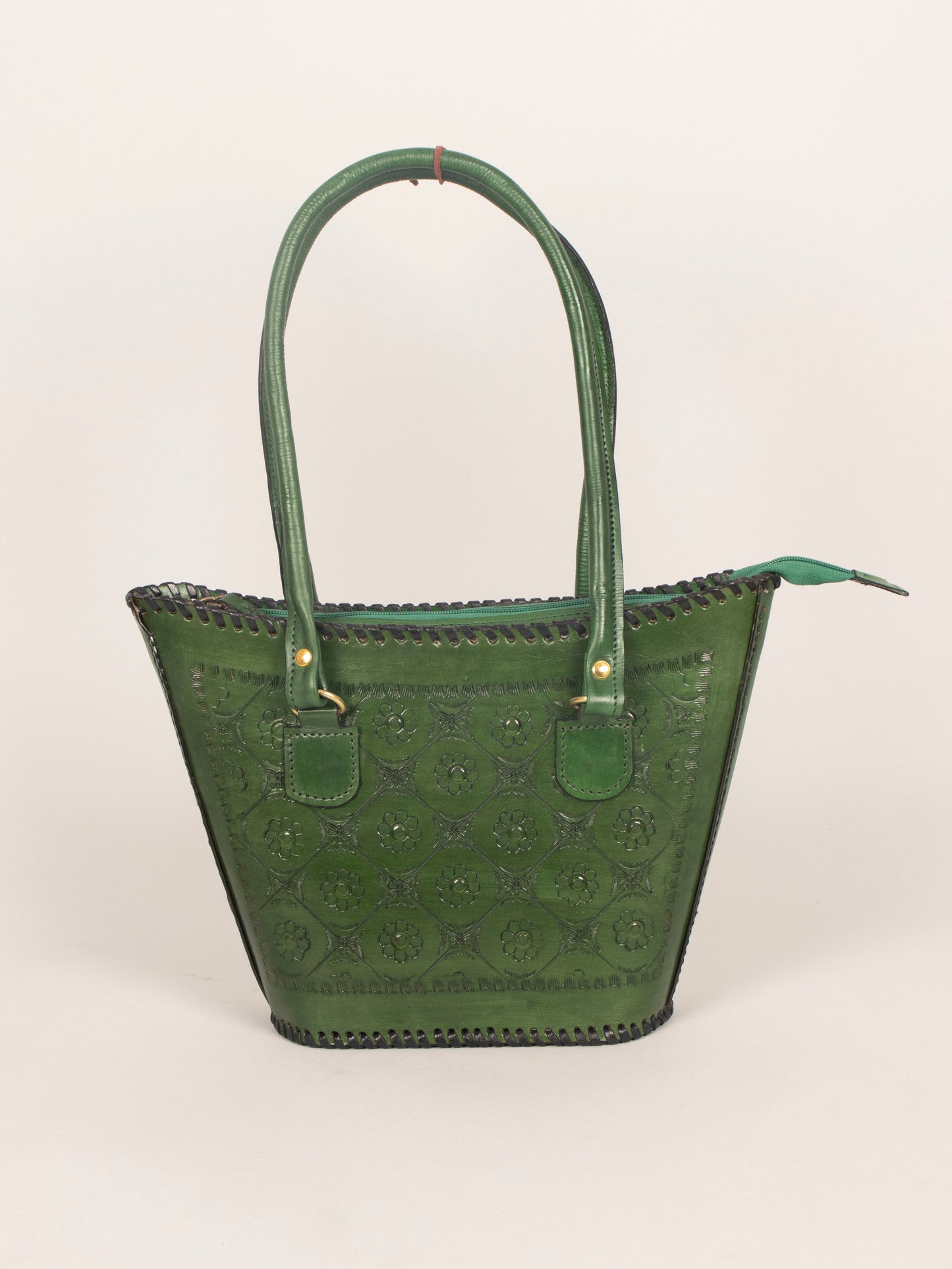 Interior view showing organized compartments of leather handbag – includes zip pocket and mobile/card slot.