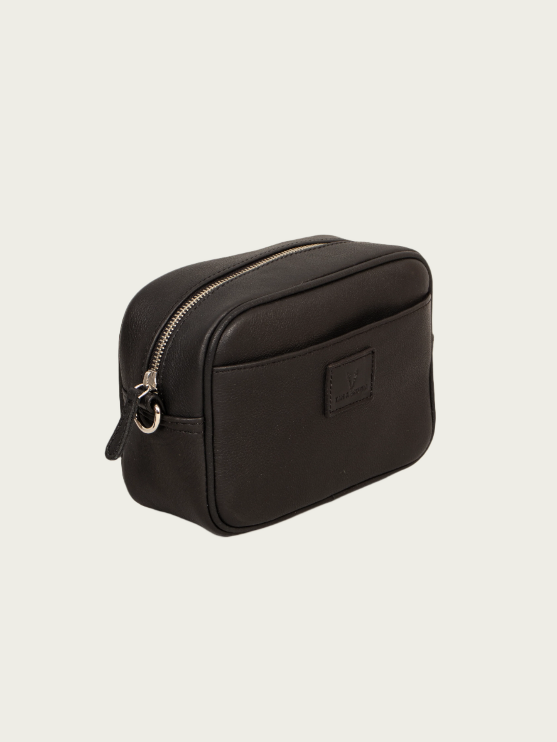 Stylish black sling bag side profile with adjustable strap